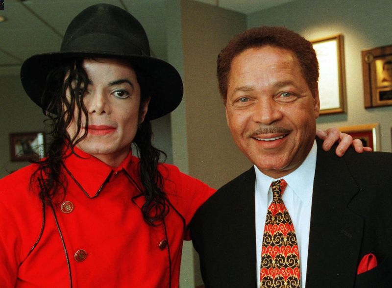 Pop super-star Michael Jackson and Detroit businessman Don Barden, right, pose in Barden's Detroit office during an interview with the Associated Press Wednesday, July 8, l998. Barden and Jackson on Tuesday announced plans for a $1 billion entertainment-and-casino complex. On August 4, Detroit voters will be confronted with ballot choices to approve Detroit Mayor Dennis Archer's three casino plan or approve a casino pitched by Barden, though the ballot does not specifically name him. Barden said Tuesday that if he doesn't get one of Detroit's casino licenses, then his Detroit development deal with Jackson will be off. (AP Photo/Richard sheinwald)