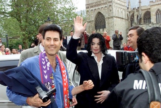 Picture by Simon Burt. 14.6.02. Michael Jackson arrives at the Royal Clarence hotel in Exeter along with Exeter City Co Chairman Uri Geller ready for an audience with Michael Jackson at the club this afternoon.