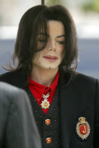 US pop star Michael Jackson arrives at the Santa Barbara County Courthouse for day 19 of his child molestation trial in Santa Maria, California Thursday, 24 March 2005. DAMIAN DOVARGANES/AP/POOL (Photo by Damian Dovarganes/WireImage)
